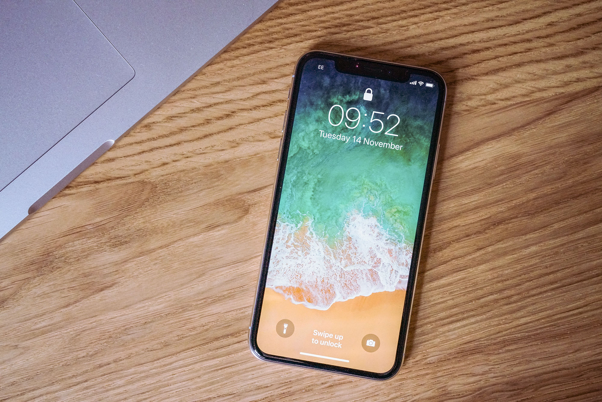iPhone on wooden desk